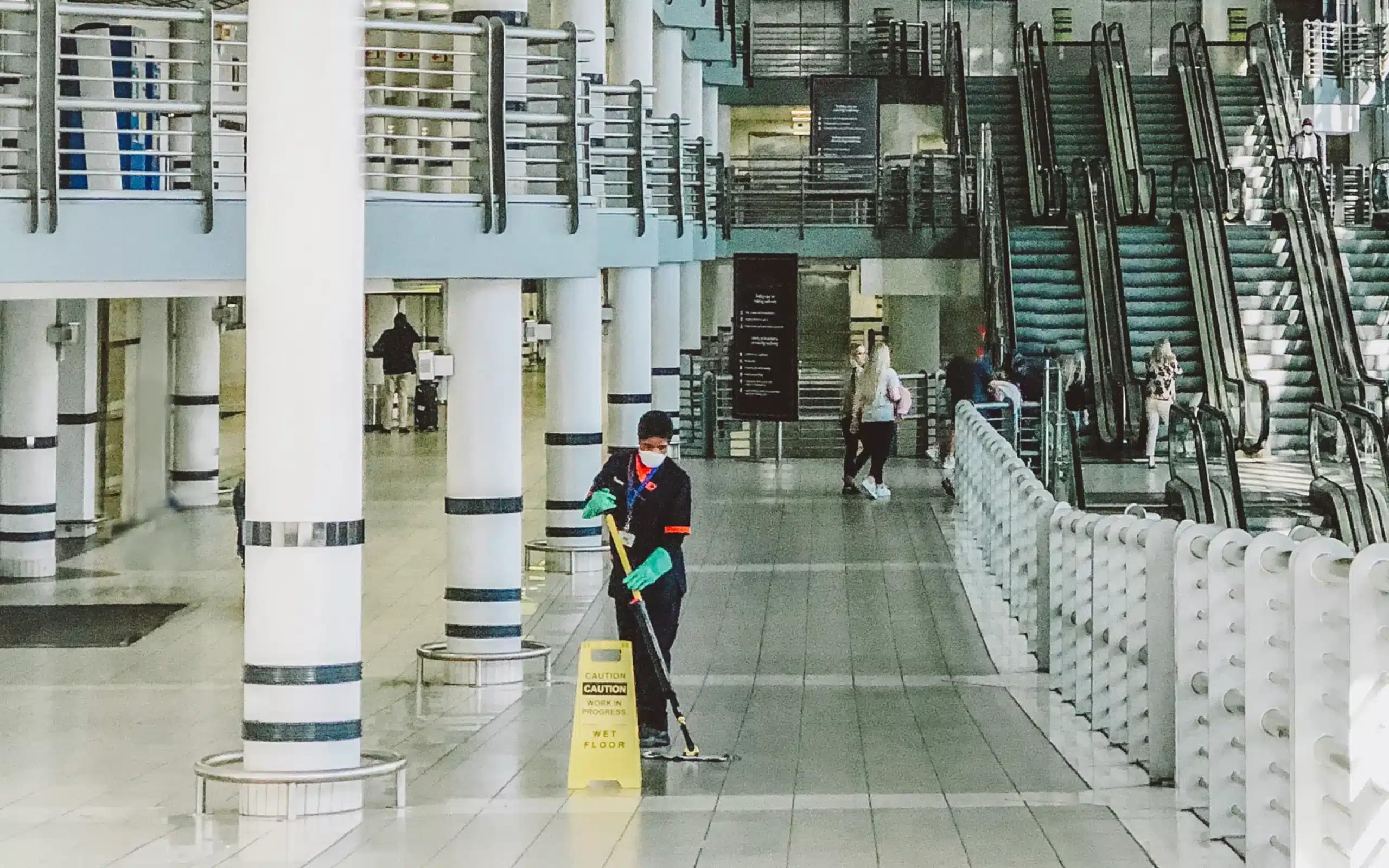 Oryx cleaning and hygiene staff working a client site in branded workwear — the 3,500 distributed people this story is about